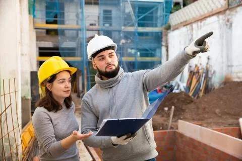 Engineers inspecting process of building overhaul Fotos de archivo
