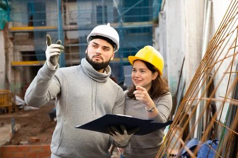 Engineers inspecting process of building overhaul Fotos de archivo