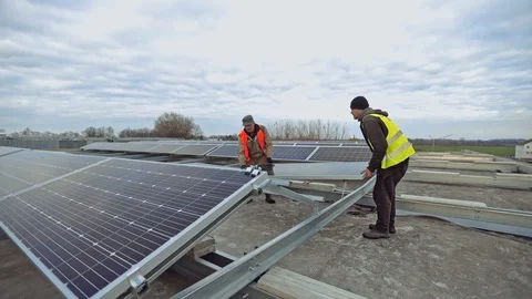 Engineers installing new solar panel.  Video stock 128239968