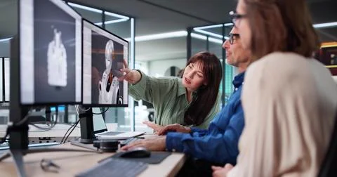 Engineers In The Lab Designing An Autonomous AI Robot Prototype. Stock Photos