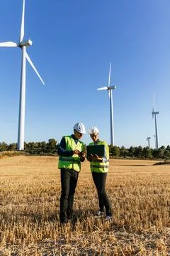 Engineers with laptop computer planning and working for renewable energy Stock Photos