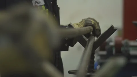 Engineers lifting long steel rods Stock Footage 106957974