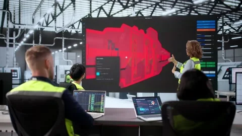Engineers Looking At 3D CAD Model Design Stock Footage 321551063