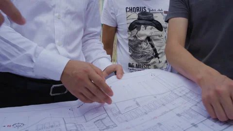 Engineers looking at drawings on the construction site, Tanzania  Africa Stock Footage 132315366