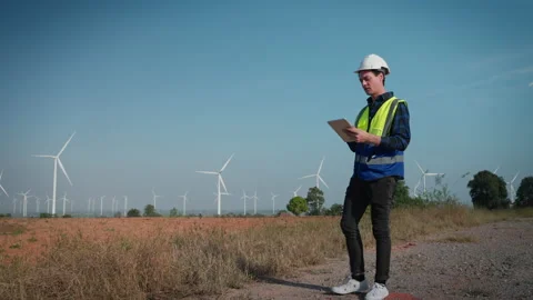 Engineers men working at wind turbine farm. Stock Footage 228992158
