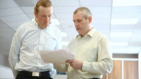 Engineers in the office to discuss the documents Stock Footage 63132534