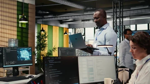 Engineers in office doing software development to launch new features Stock Footage 322702089