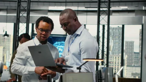 Engineers in office doing software development to launch new features Stock Footage 323236934