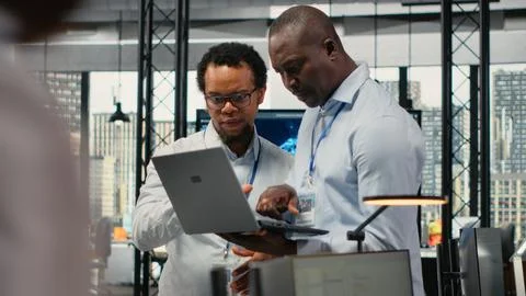 Engineers in office doing software development to launch new features 스톡 사진