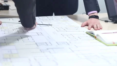 Engineers plan to build and using drawings Stock Footage 87085954