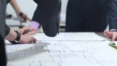 Engineers plan to build a building using drawings Stock Footage 87085914