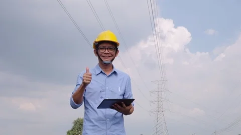 Engineers at the power plant with tablets in hand, work diligently. Slow motion Stock Footage 118210857