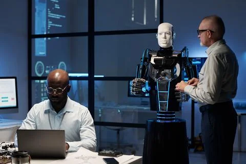 Engineers programming robot in the lab Foto stock