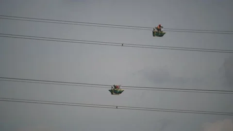 Engineers replacing high tension electricity cables united kingdom Stock Footage 213303618