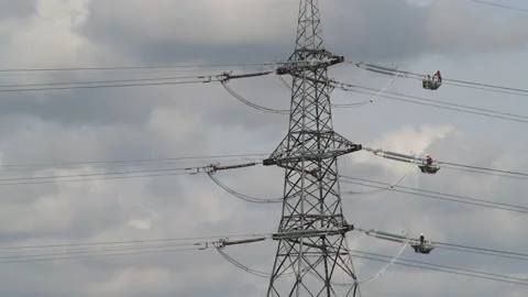 Engineers replacing high tension electricity cables united kingdom Stock Footage 213303828