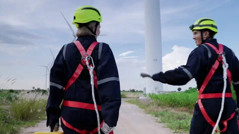Engineers in safety gear working at height walking to the maintenance station Stock-Footage 166313019