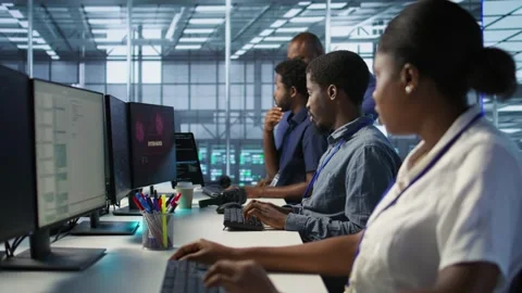 Engineers seeing system hacked popup on PC screen in data center Stock Footage 319523620