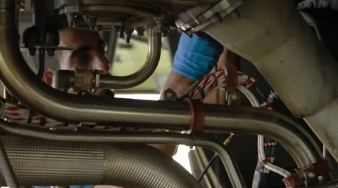 Engineers Servicing Large Jet Engine Stock Footage 62202217