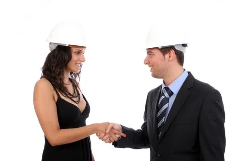 Engineers shaking hands and completing deal Stock Photos