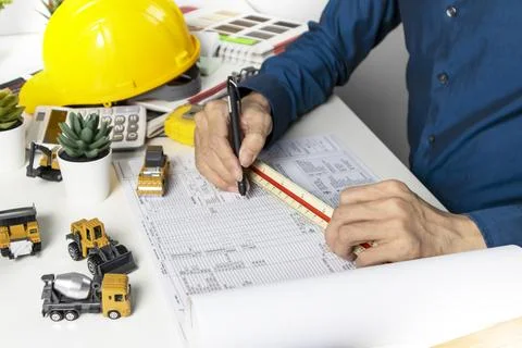 Engineers sit and work on building design and system work.,construction wor.. Fotos de archivo