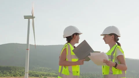 Engineers specializing in green energy are conducting a thorough review of wind Video stock 281498902