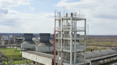 Engineers stand on the large industrial building. Industrial pipes of plant Stock Footage 170148738