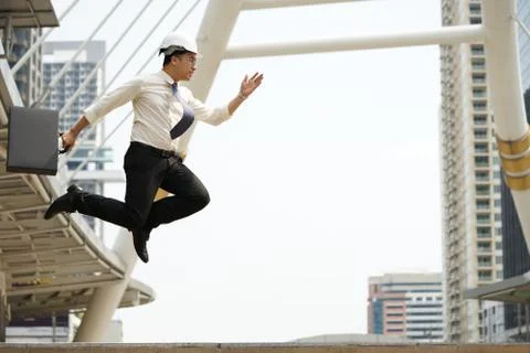 Engineers strive jump high as possible in order achieve goals Foto stock