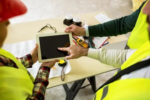 Engineers with tablet at construction site Stock Photos