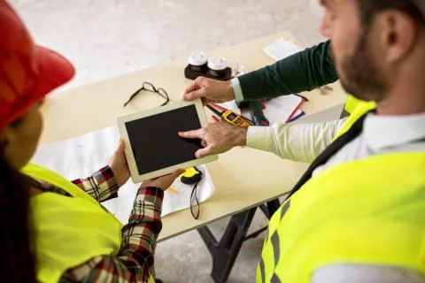 Engineers with tablet at construction site Stock-Fotos