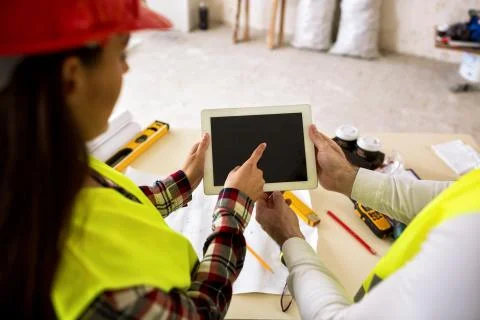 Engineers with tablet at construction site Stock-Fotos