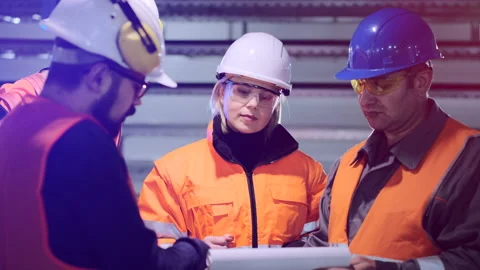 Engineers talk reading papers at wind power plant station Video stock 144101250