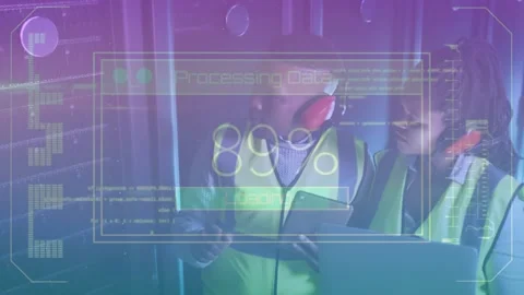 Engineers tapping tablet in server room showing overlay progressing to 100% 動画素材 319572688