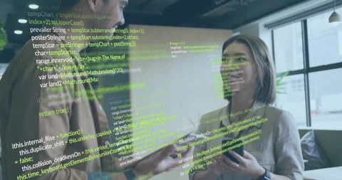 Engineers tapping tablet while reading code on phone by window showing green Stock Footage 313494413