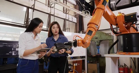 Engineers Team Control Robotic Arm Works and Moves. Video stock 126879545