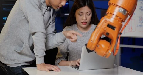 Engineers Team Control Robotic Arm Works and Moves. Stock Footage 126880751