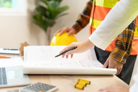 Engineers team discuss check and review the blueprint of construction. Cont.. Stock Photos