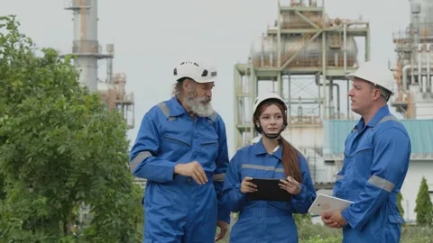 Engineers Team Senior Young Man and Woman Discussing Survey Work Outside Oi.. Stock Footage 347724902
