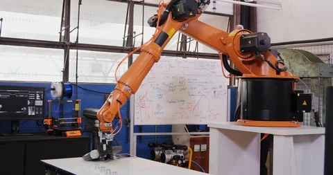 Engineers Team talking Robotic Arm Works and Moves. Stock Footage 126880096