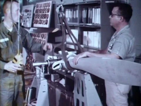 Engineers test and repair an army aircraft propeller and engine in a Stock Footage 75303078
