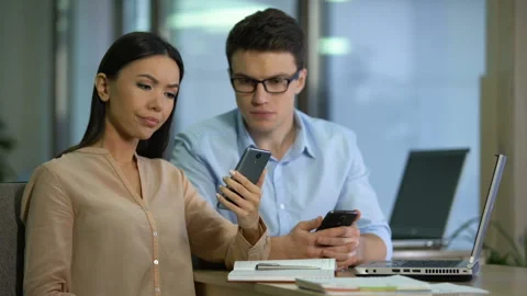 Engineers testing new smartphone, disappointed with software quality, test group Stock Footage 102891222