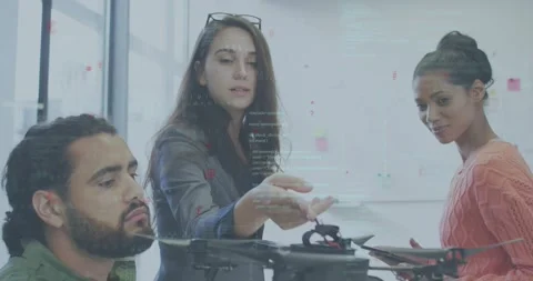Engineers testing quadcopter, lead showing and starting AR callouts while tech Stock Footage 320585481