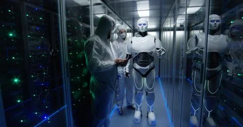 Engineers testing on robot controls inside the laboratory Stock Photos