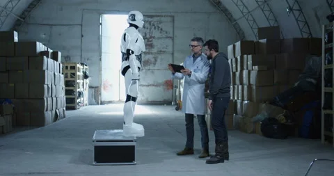 Engineers testing robot in a warehouse Stock Footage 108125258