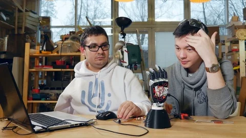 Engineers testing the robotic bionic arm Stock Footage 72985375