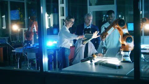 Engineers training industrial robot using VR technology Stock Footage 145598146