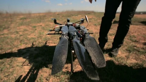 Engineers unfold the screws of the Copter before takeoff. Stock Footage 75862701