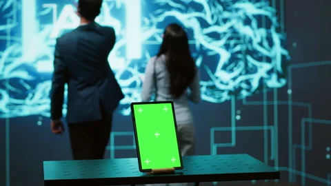 Engineers use green screen tablet and AI neural networks to look at data Stock Footage 278623710