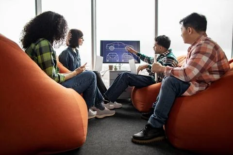 Engineers using display with data during meeting in office Stock Photos
