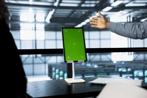 Engineers using mockup tablet in data center, managing server virtualization Stock Photos