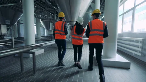 Engineers walking in a brewery facility, back view. Stock Footage 102385529